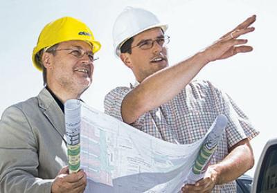 workers holding drawing